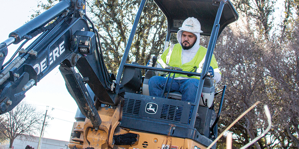 Gas Construction Operations Technician Jonathan Sanchez digs up a gas line in Plano. Photo by NICHOLAS SAKELARIS