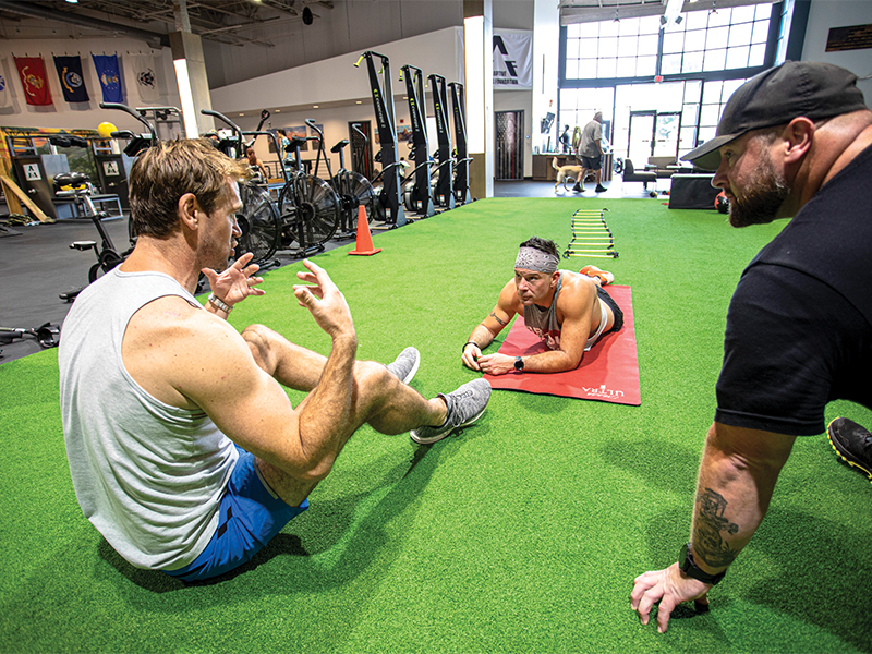 Each athlete is paired with a personal trainer who guides them through the 9-week course. Here, Luke Milton talks with his athlete, Matt Lastowski.