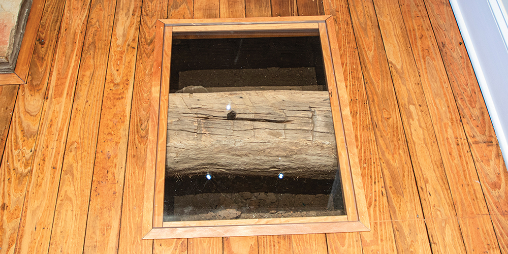 The Gibson-Grant Log Home has cut-outs that show the original logs in the walls and the floor from 1860. 