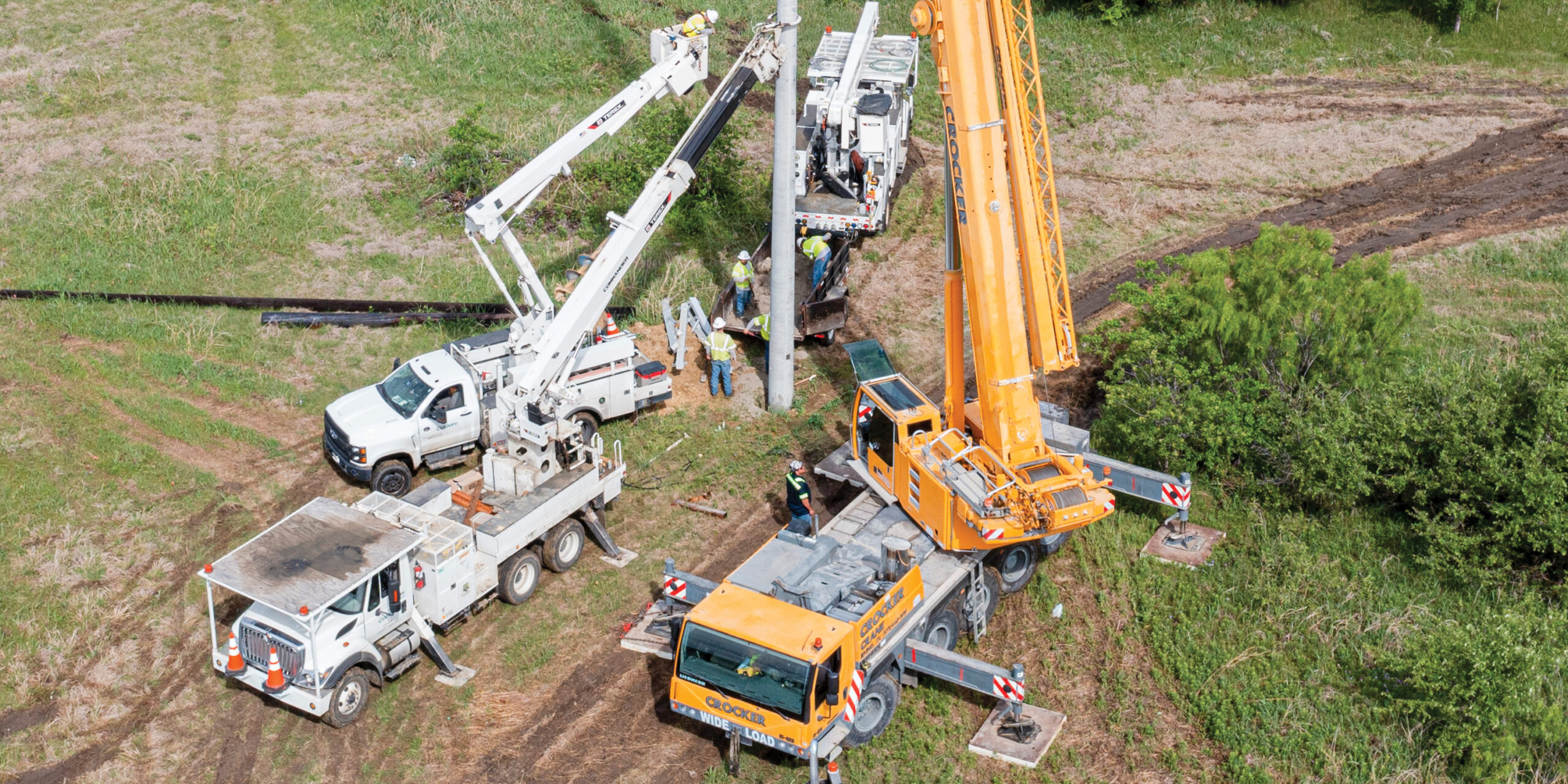 A crane installs a concrete pole on U.S. 377. Photo by KEN OLTMANN