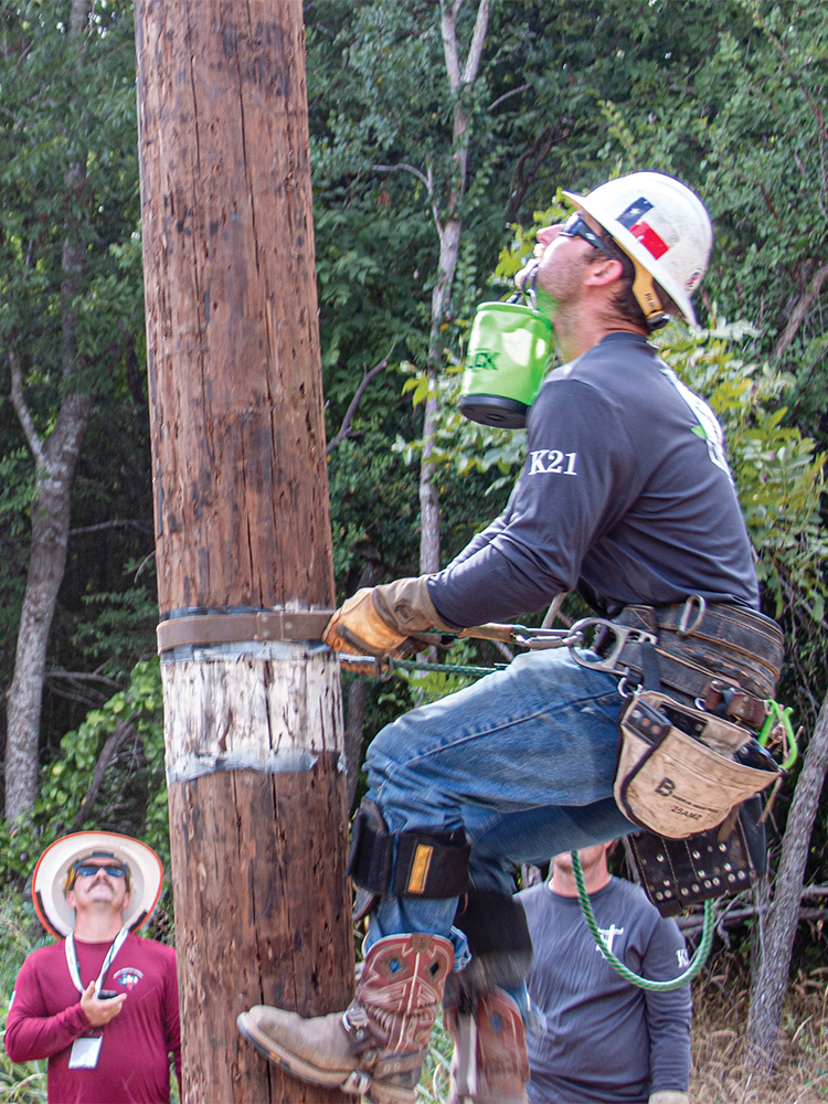Jeshua Price carefully climbs a pole while carrying an egg inside a pouch in his mouth.