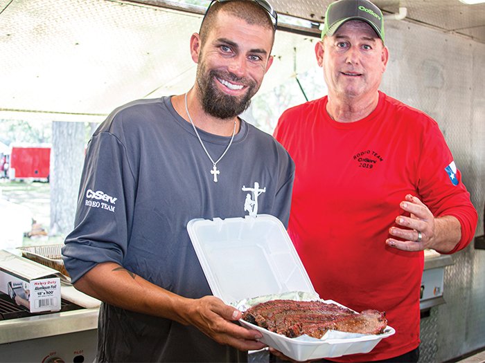 Cramer Basham and Jeff Richardson stayed up all night to smoke brisket for the BBQ competition.