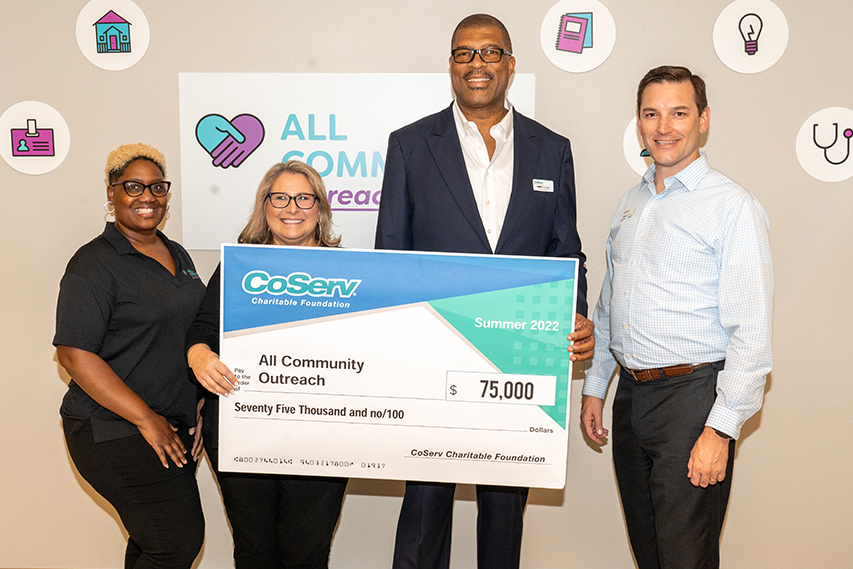 CoServ Board District 4 Director Mark Rutledge and Director of Community Engagement Glen Squibb awards All Community Outreach with a check for 75,000 from CCF.