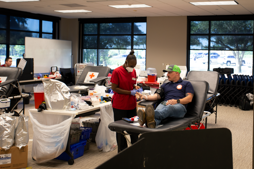 Eric Maray donates blood early Friday morning, completing his fifth blood donation of the year.