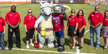 FC Dallas and CoServ help build a mini pitch for MyPossibilities, an organization that helps people with disabilities.