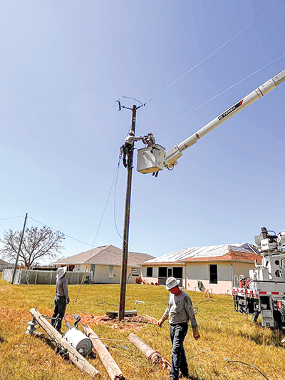 CoServ crews work to restore power in hard-hit Lee County. Photo by CoServ Operations