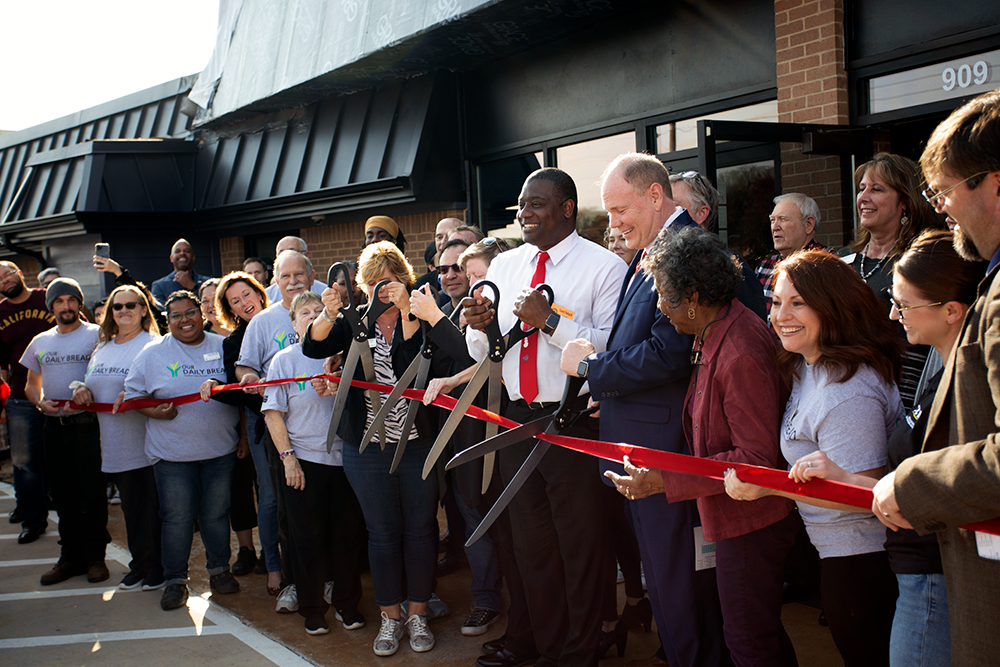 City and Our Daily Bread officials cut the ribbon at the new 34,000-square-foot facility in Denton. Photos by DARRECK KIRBY