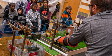CoServ Energy Education Specialist Justin Porterfield presents the PowerTown display to 3rd graders at Tadlock Elementary in Frisco ISD.