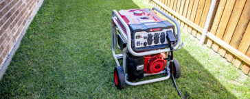 A CoServ Member sets up his portable generator in the side yard. Photo by KEN OLTMANN