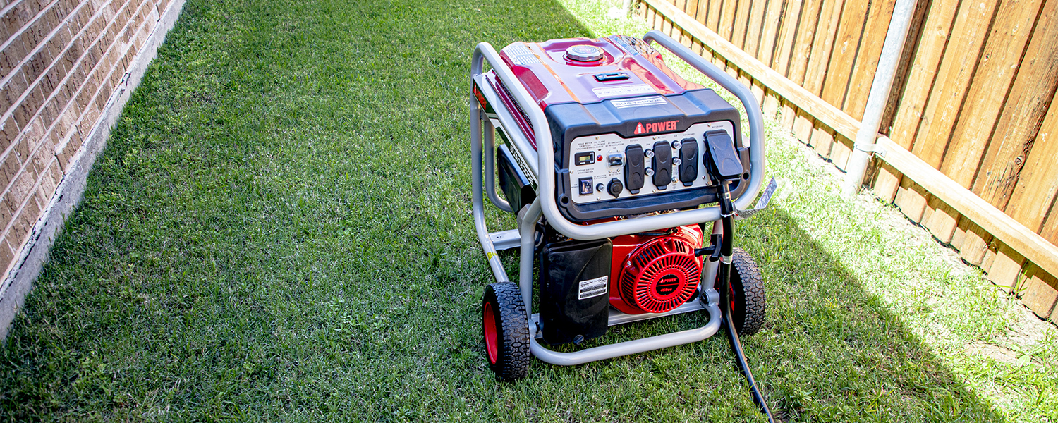 A CoServ Member sets up his portable generator in the side yard. Photo by KEN OLTMANN