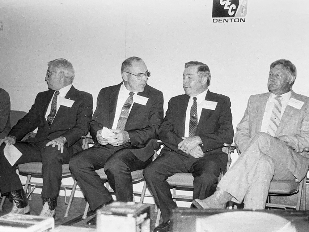 Virgil Berend, second from right, remembers the day that Denton County Electric Cooperative (now CoServ) brought electricity to his farm for the first time.  COSERV ARCHIVES