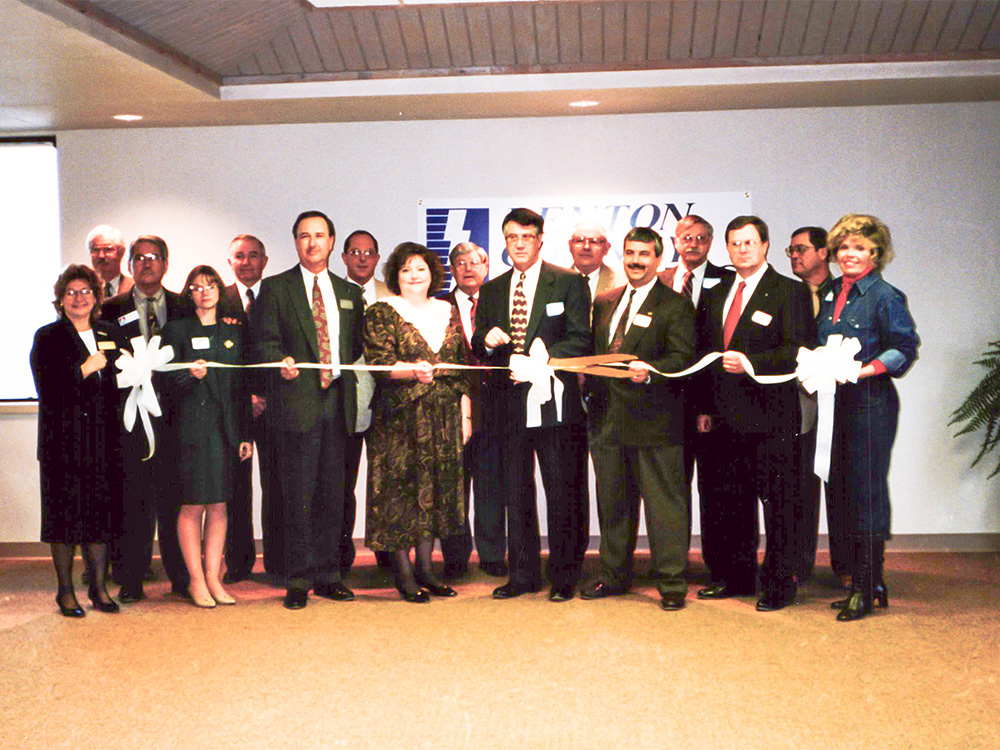 Denton County Electric Cooperative leaders, including Virgil Berend, third from left in the back row, celebrate the expansion of the former DCEC headquarters on Swisher Road. COSERV ARCHIVES