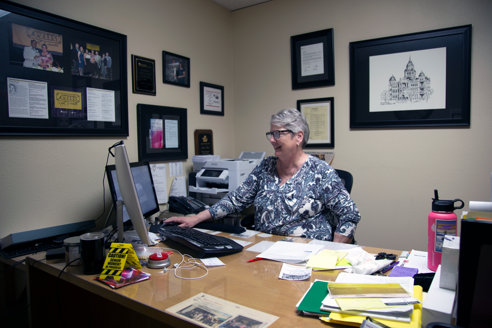 Susan Frank working in her office at Hearts for Homes