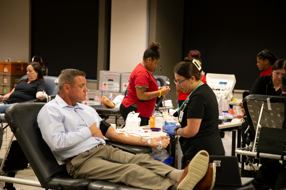 Ben Crawford donates blood at the 7th CoServ blood drive
