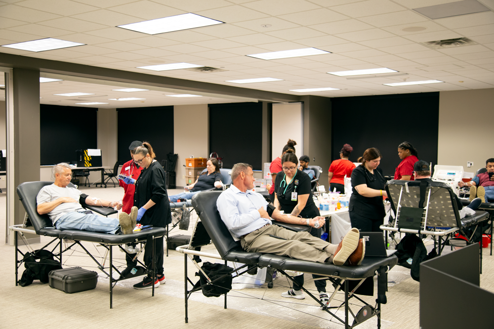 Ben Crawford and others give blood at CoServ Blood Drive
