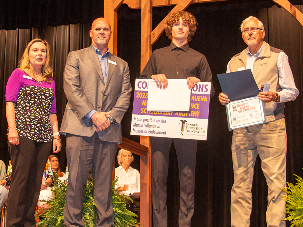 05-2023_blog_Sanger-Scholarships_4032 CoServ Board District 1 Director Richard Muir and Senior Vice President Field Operations Shea Hassell and CCF and Outreach Coordinator Jennifer Ebert awarded Sanger High School graduate Chase Wernimont a VIP experience at the Frisco RoughRiders. Chase had perfect attendance from kindergarten through 12th grade at Sanger ISD.