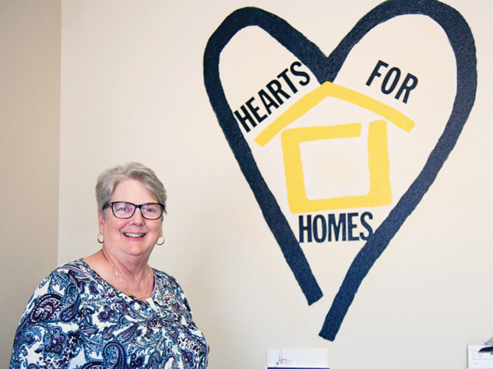 Founder Susan Frank stands in the Hearts for Homes front lobby in Denton. Photo by DARRECK KIRBY