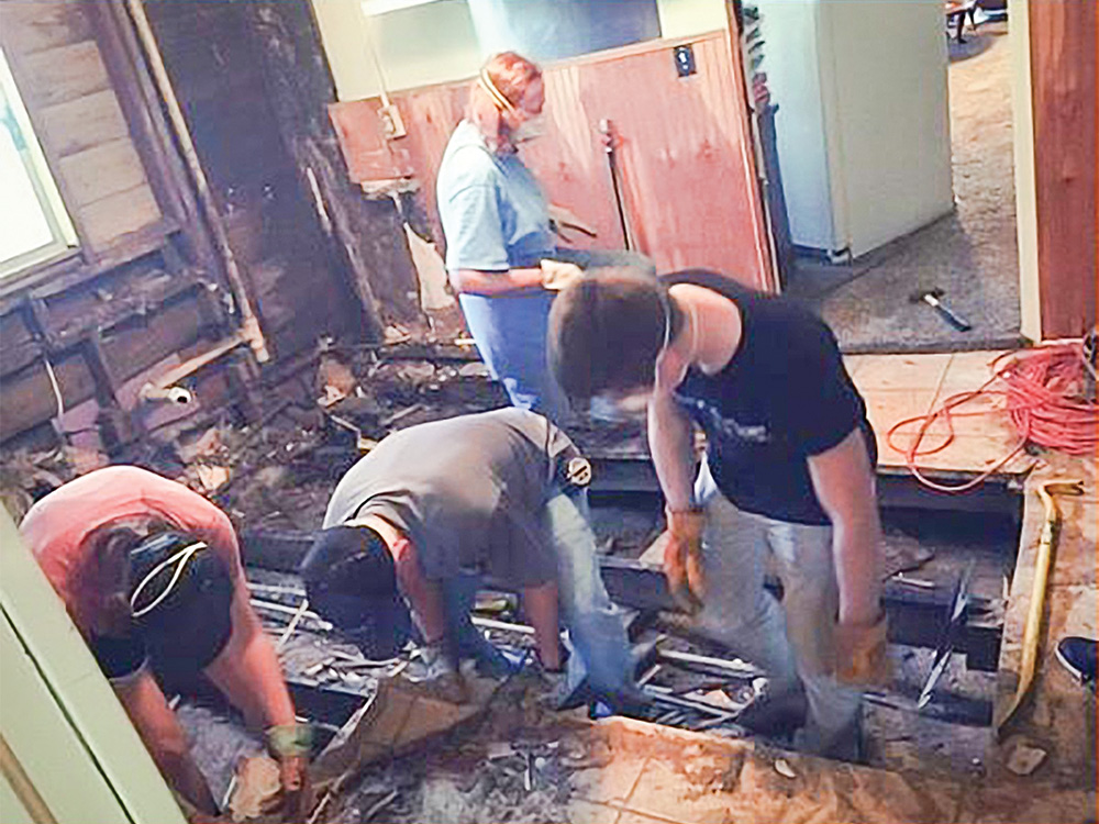 Volunteers renovate a senior’s kitchen on a Saturday morning. Photo courtesy of Hearts for Homes