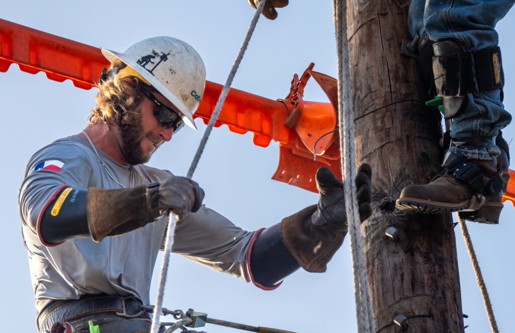 CoServ's 2023 Linemen Rodeo Journeyman Team member JP Price competes in the Transformer Changeover event at the Texas Lineman Rodeo Association's annual Lineman Rodeo in Seguin, TX.