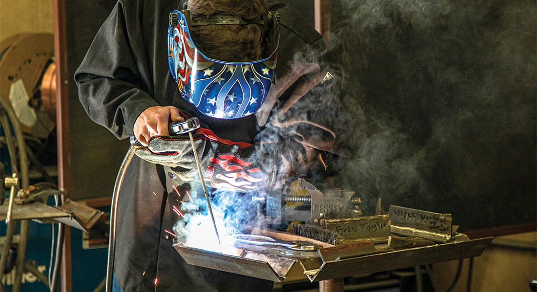 Eric Taylor does an AWS certification weld. Photos by KEN OLTMANN