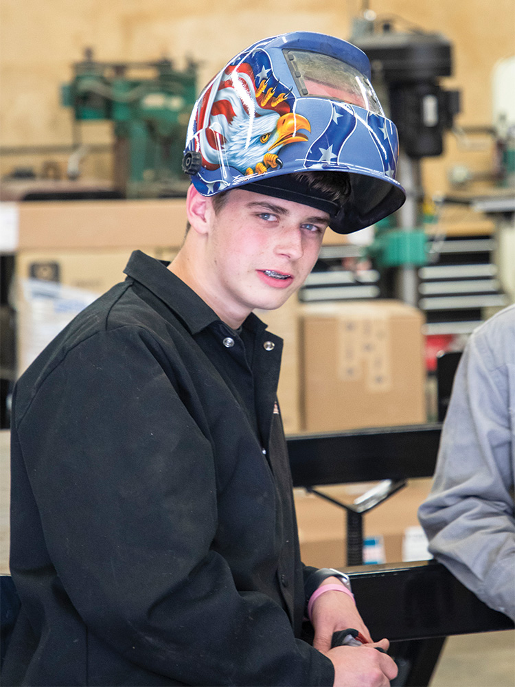 Eric Taylor prepares to weld.
