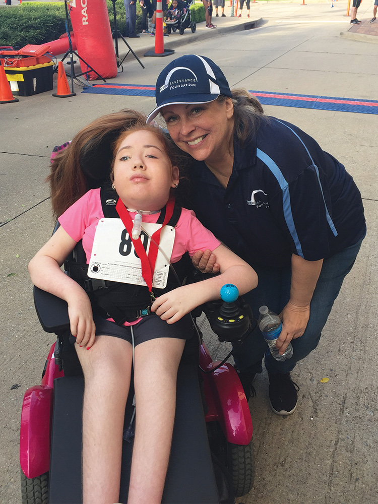 Cindi Cooperman with Kiley, who received a wheelchair from NAF.