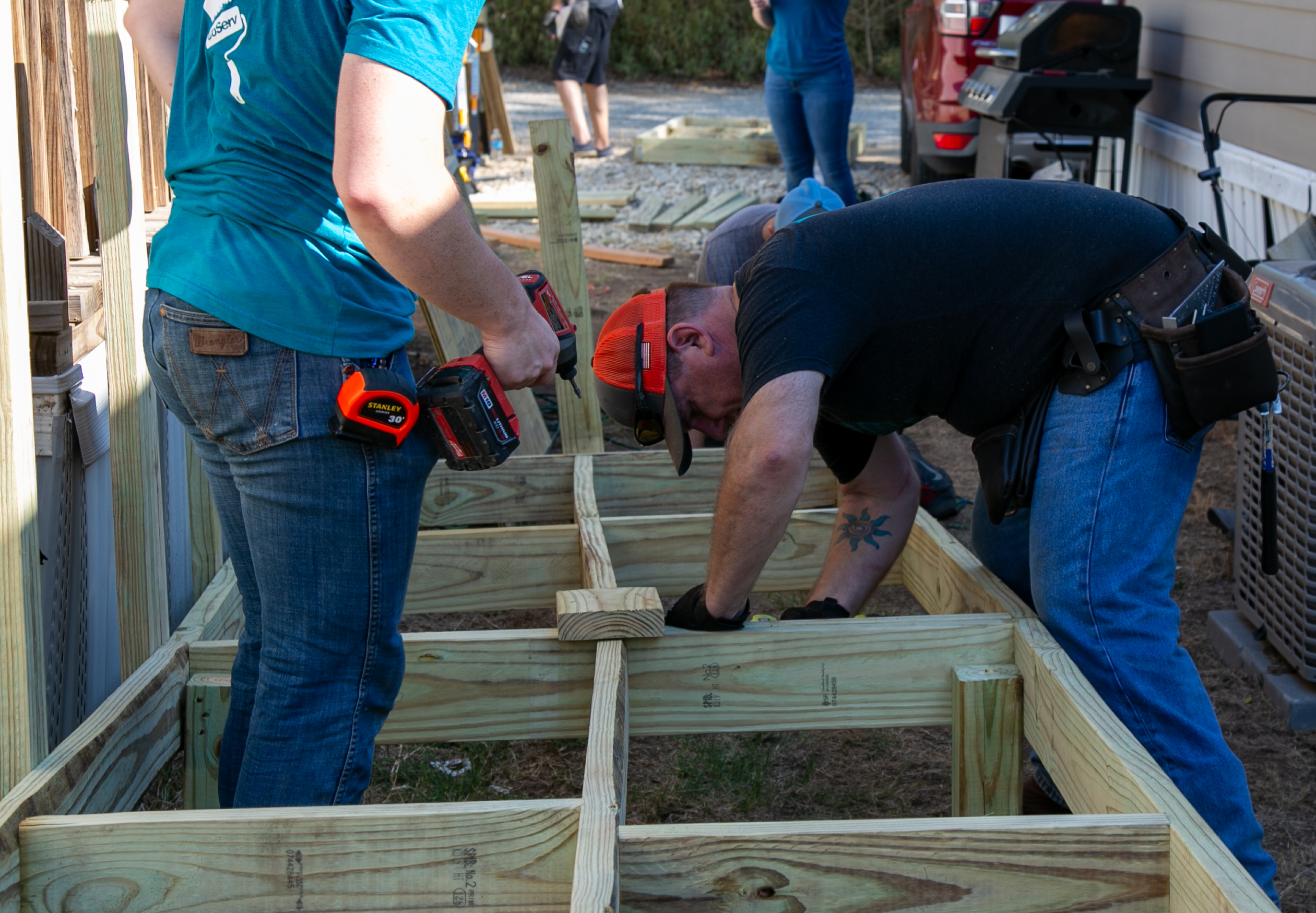 Teamwork is key for CoServ Employees to build a 48-foot ramp in one morning. 