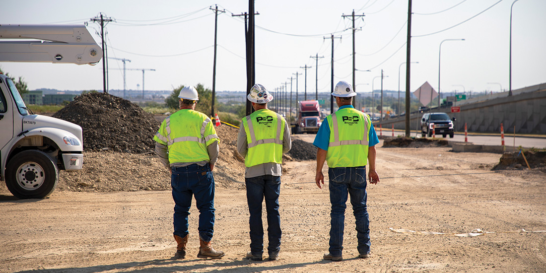 Ronny Allen and contractors from Primoris Services Corp. oversee the job site. Photos by KEN OLTMANN