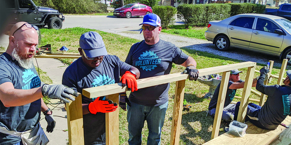 CoServ employees build a ramp for a resident in Denton as part of Texas Ramp Project. Photo by NICHOLAS SAKELARIS