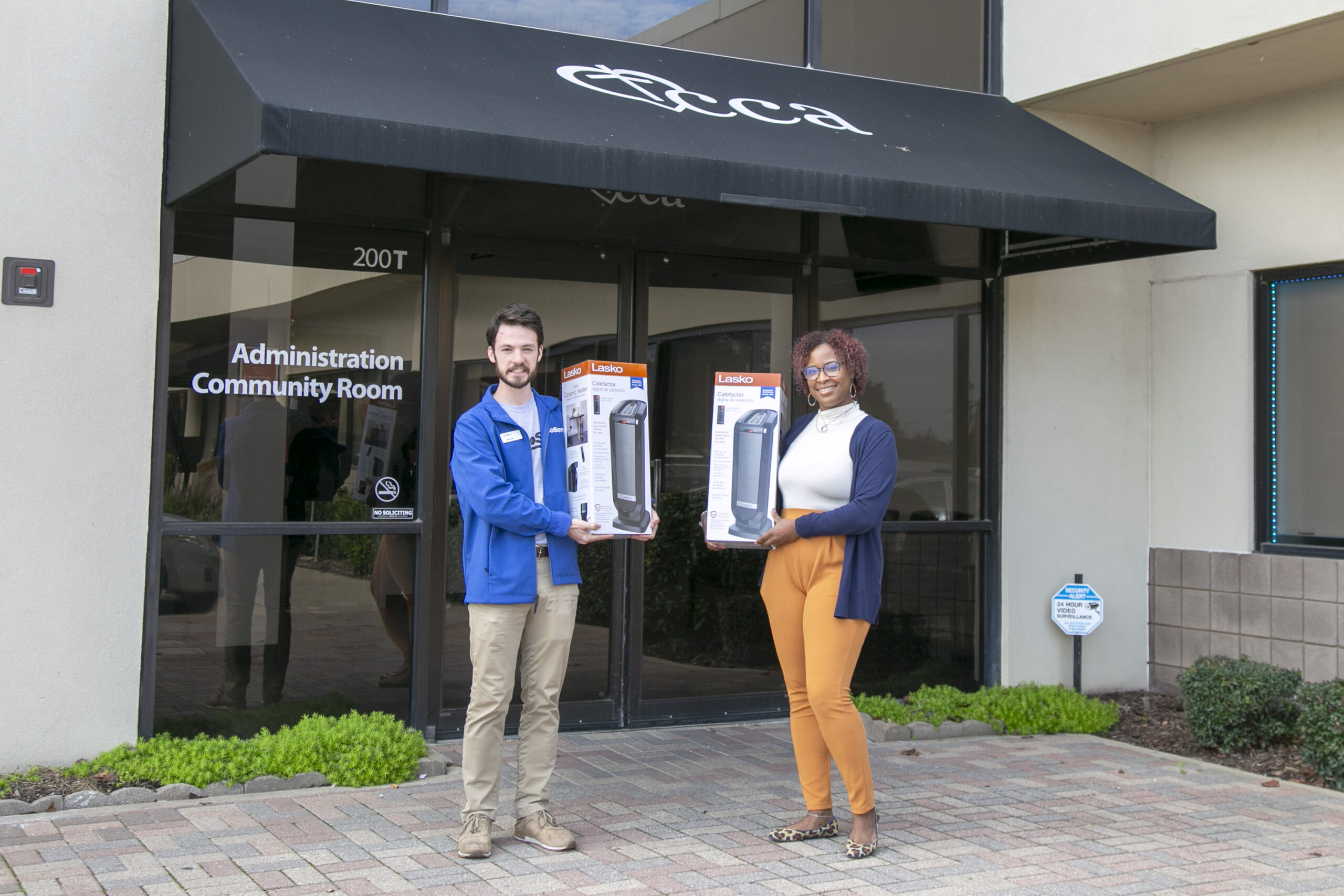 Community Event Specialist Walker Sims delivered much-needed heaters to Daphne Houston, Director of Programs at Christian Community Action. 