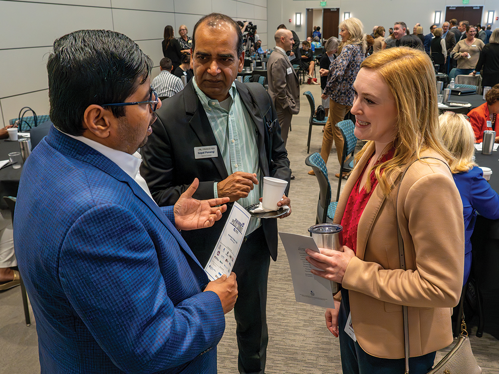 CoServ Relationship Development Manager Jenny Katlein (B) met ith community leaders at the Collin Leadership Policy Summit. Photo by BRIAN ELLEDGE