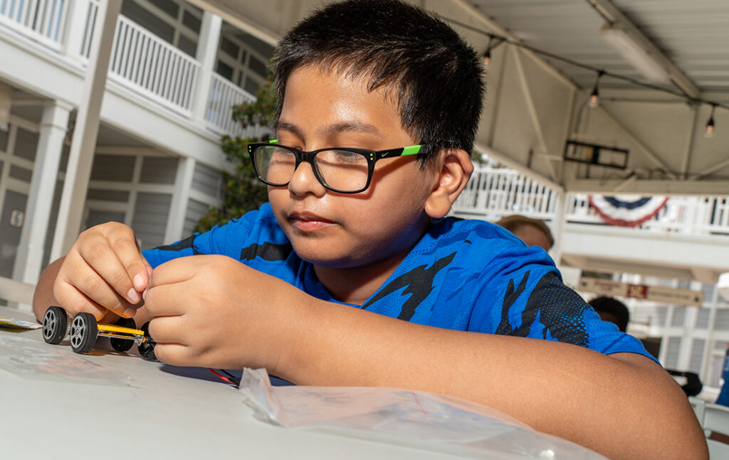 CoServ STEM program building solar cars held in conjunction with the RoughRiders in Frisco.