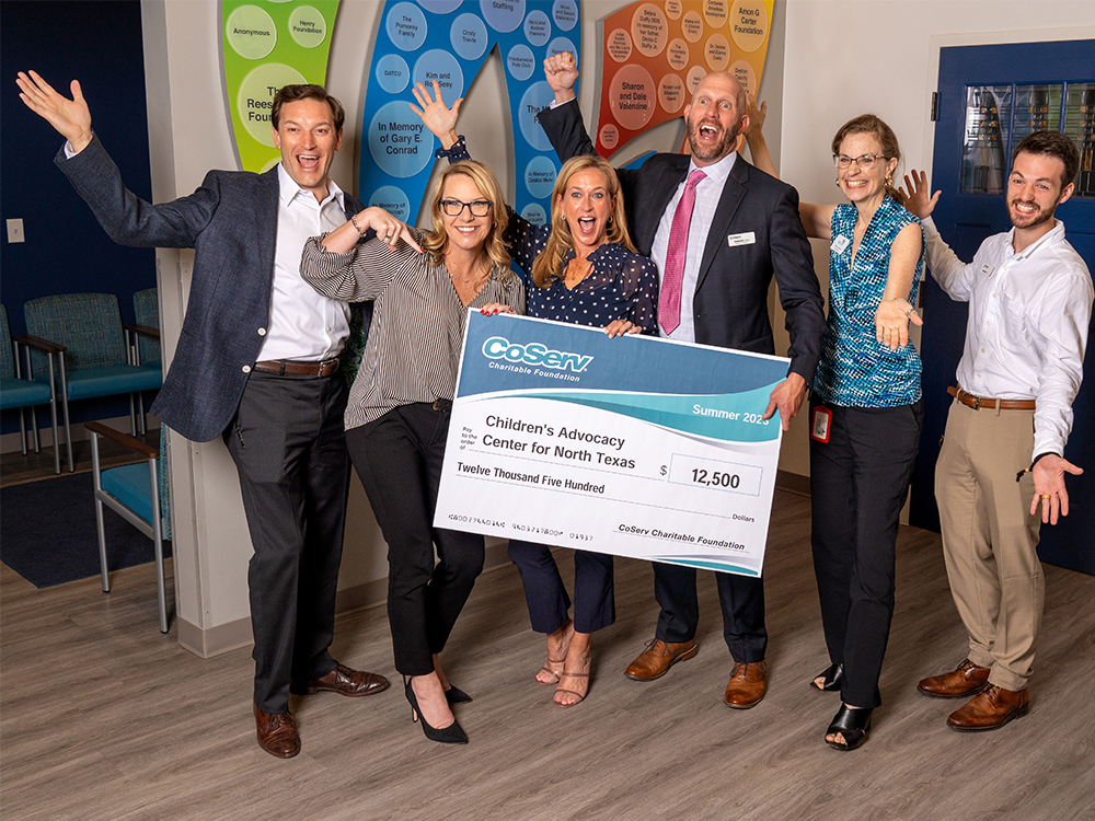 CoServ Charitable Foundation grants 12,500 to Children's Advocacy Center for North Texas for emergency supplies of food, clothing, school supplies and housing needs. (L to R) CoServ Director of Community Engagement Glen Squibb, Children's Advocacy Center for North Texas CEO Kristen Howell, CoServ District 7 Director Chance Adair, CAC Director of Development Suzann Woodard, CAC Grants Manager Kate Lynass, and CoServ Community Events Specialist Walker Sims.