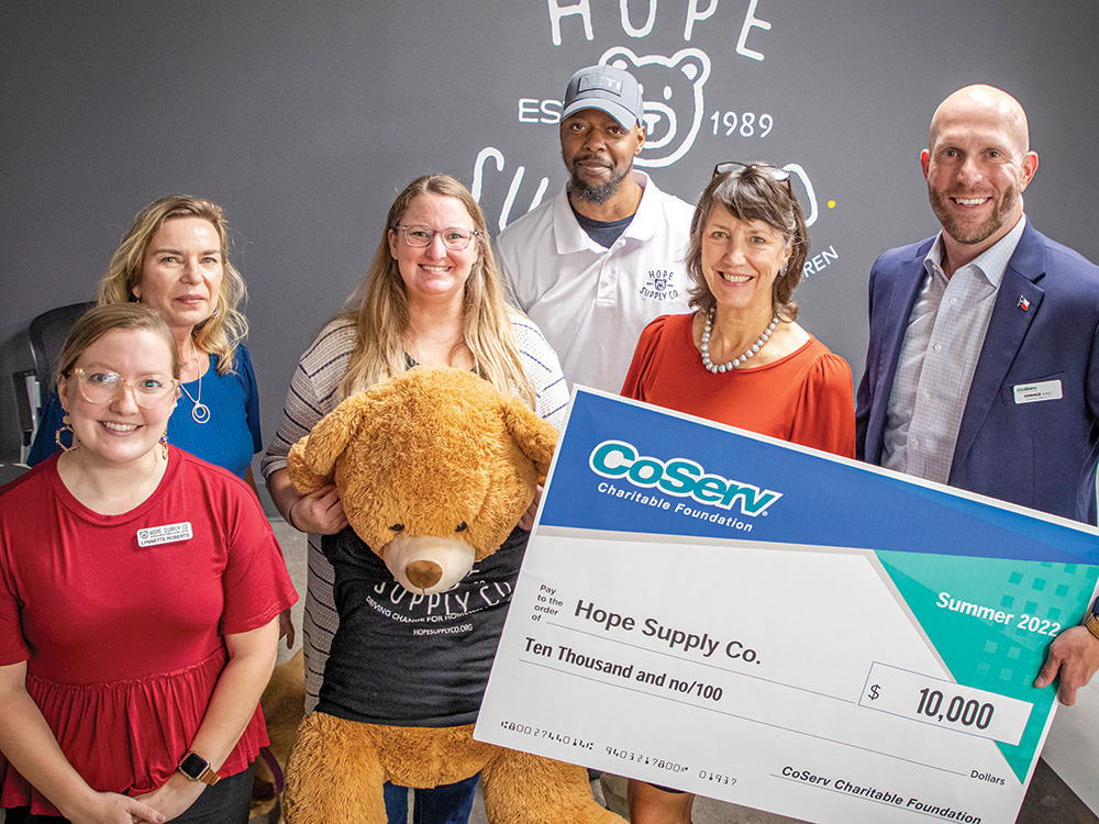 CCF Check presentation with Board Director Chance Adair and Jennifer Ebert to Hope Supply Co. in Dallas. Photo by KEN OLTMANN
