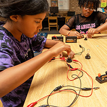 Students work through the CoServ Circuit Building lesson at Denton ISD's Scholar Camp at Ginnings Elementary.