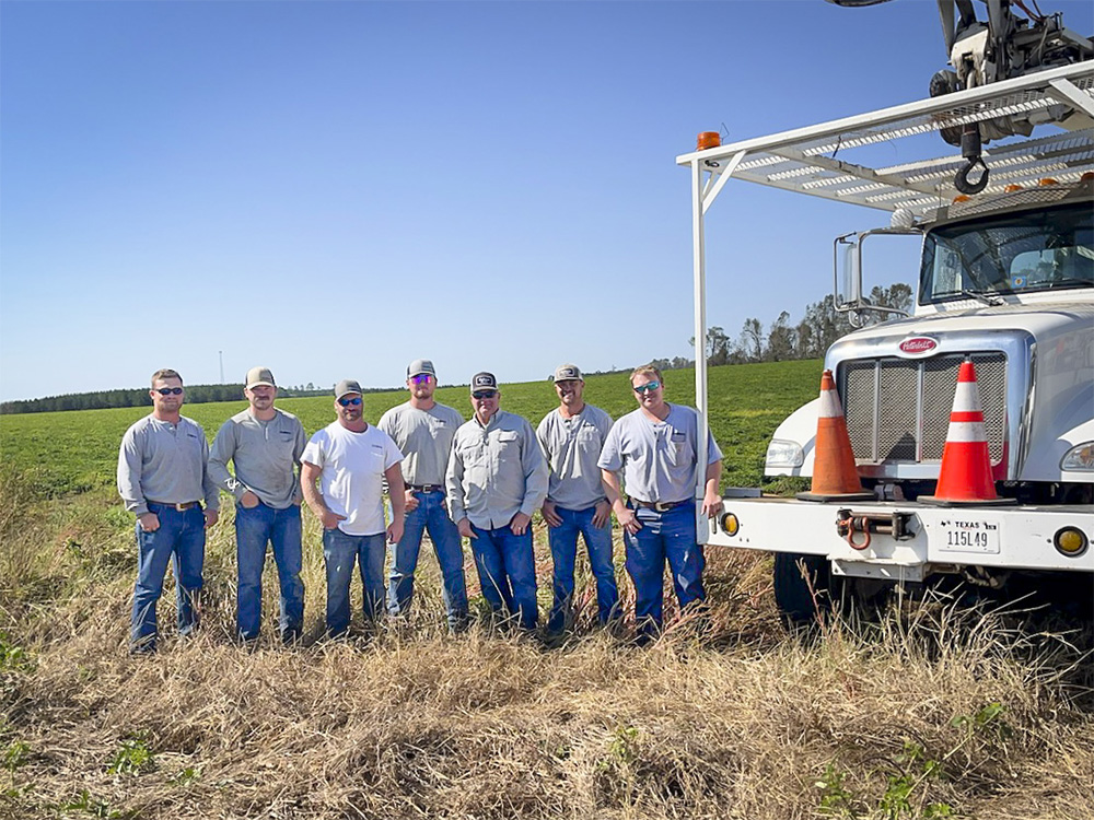 L to R: Austin Clayton, Peyton Johnston, Aaron Armstrong, Mason Horton, Luke Hawkins, Dustin Bailey and Tyler Garrett providing mutual aid to Washington EMC in Georgia after Hurricane Helene, Oct. 15, 2024.