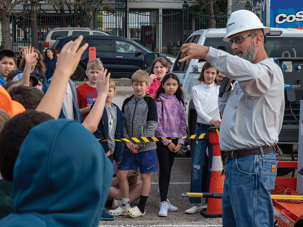 Energy Education Lead Randy Copeland performs an arcing demonstration at a local school. Photo by BRIAN ELLEDGE