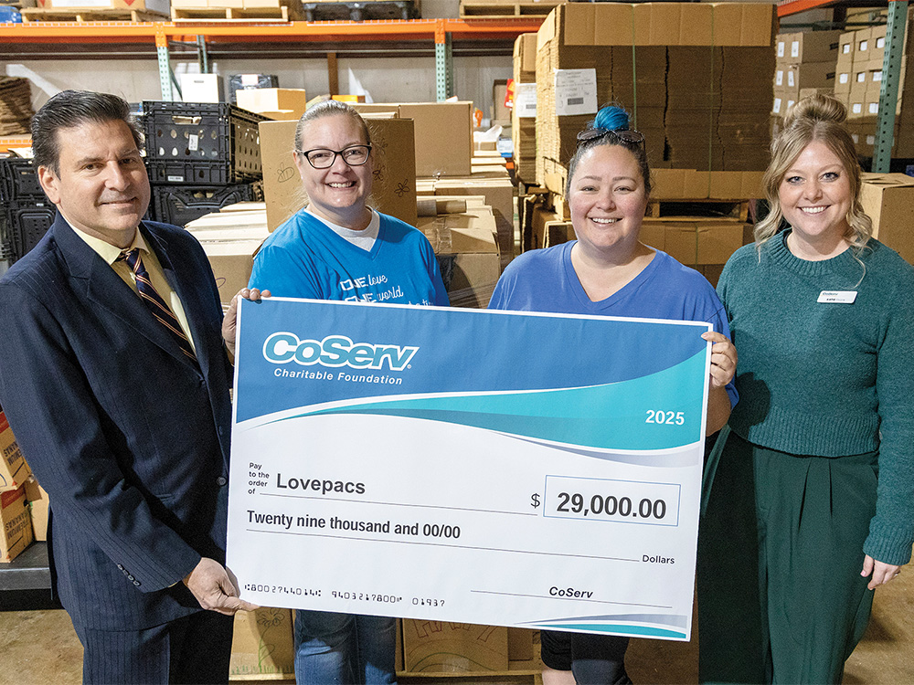 A CCF Check Presentation to Lovepacs for $29,000 to cover food costs for 2,000 students over spring break in Frisco, Little Elm, and Lewisville school districts. L-R: Will Kollar, CoServ Board of Directors District 4; Lindsay Suddreth, Lovepacs; Leah Thrapp, Lovepacs; Katie Moore, CoServ Community Events Specialist.