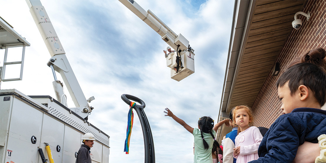 Children at the Calhoun Early Childhood School react to the bucket truck going up. Photos by BRIAN ELLEDGE