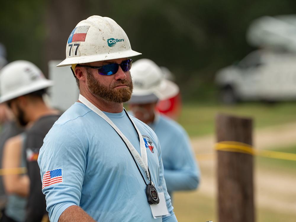 CoServ Lineman Aaron Armstrong watches over a team as a judge during the 2025 Texas Lineman Rodeo.