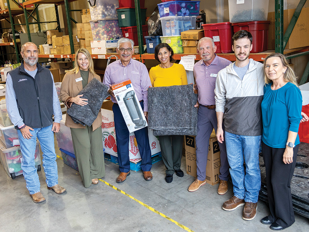 Bill Ragsdale helps deliver blankets and heaters to Christian Community Action in Lewisville. Photo by KEN OLTMANN