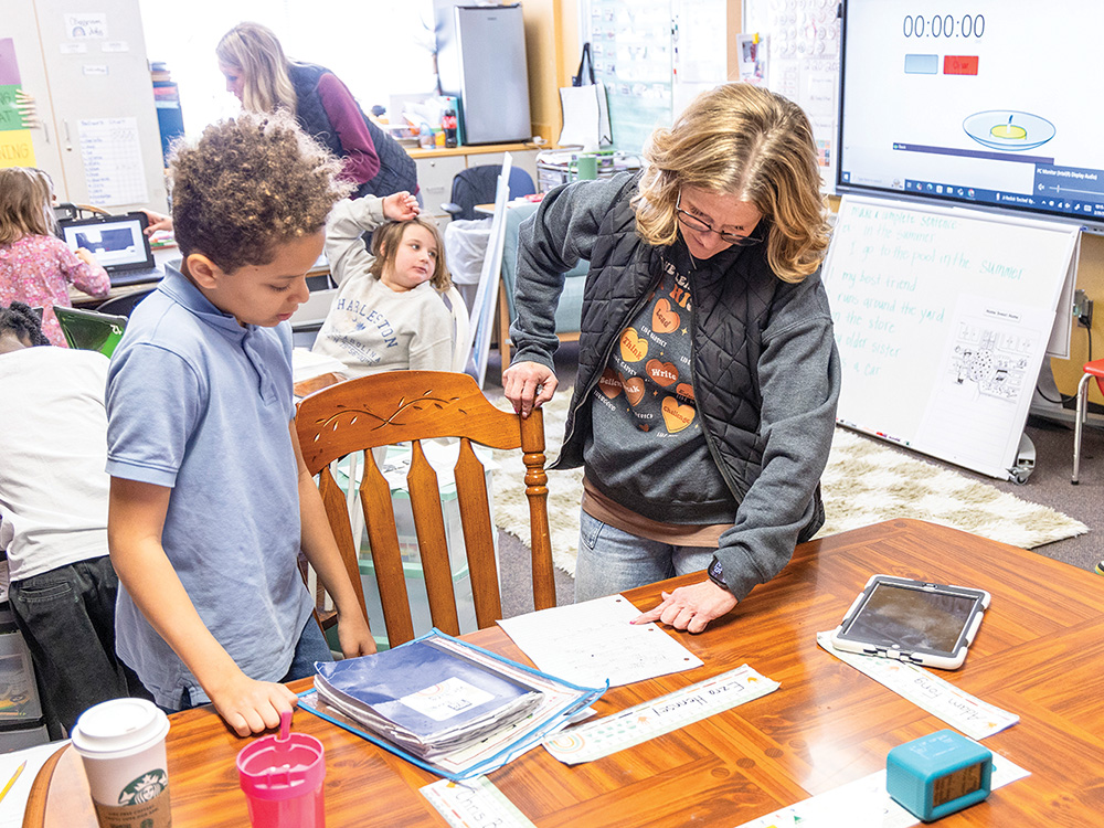 Tanya Crisp works with one of her students.