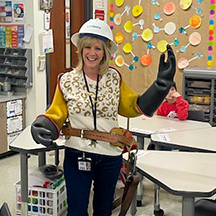 CoServ celebrates Read Across America. Teacher with lineman gear on during a Career Day for Creekside Elementary, LISD. This school will close at the end of the school year – 2025.