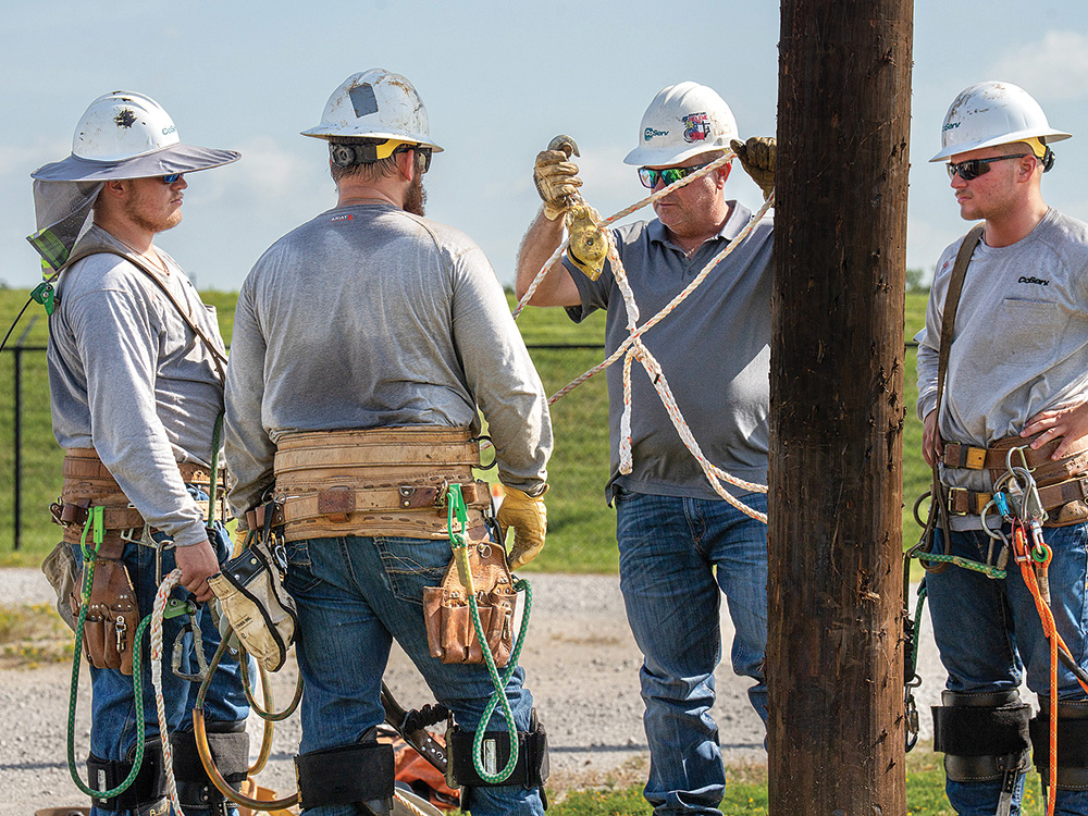 Luke Hawkins trains three new linemen on the use of a handline during the CoServ Climbing School. LEFT TO RIGHT: Tyler Garrett, Tim Canter, Luke Hawkins, Meryk Slattery