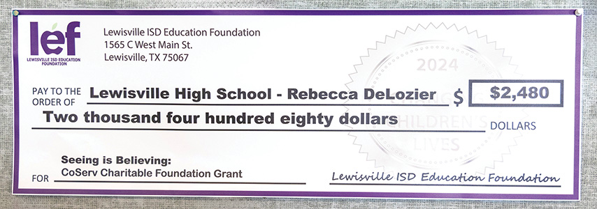 Check presented to Dr. DeLozier from the Lewisville Education Foundation, which received a grant from CCF.