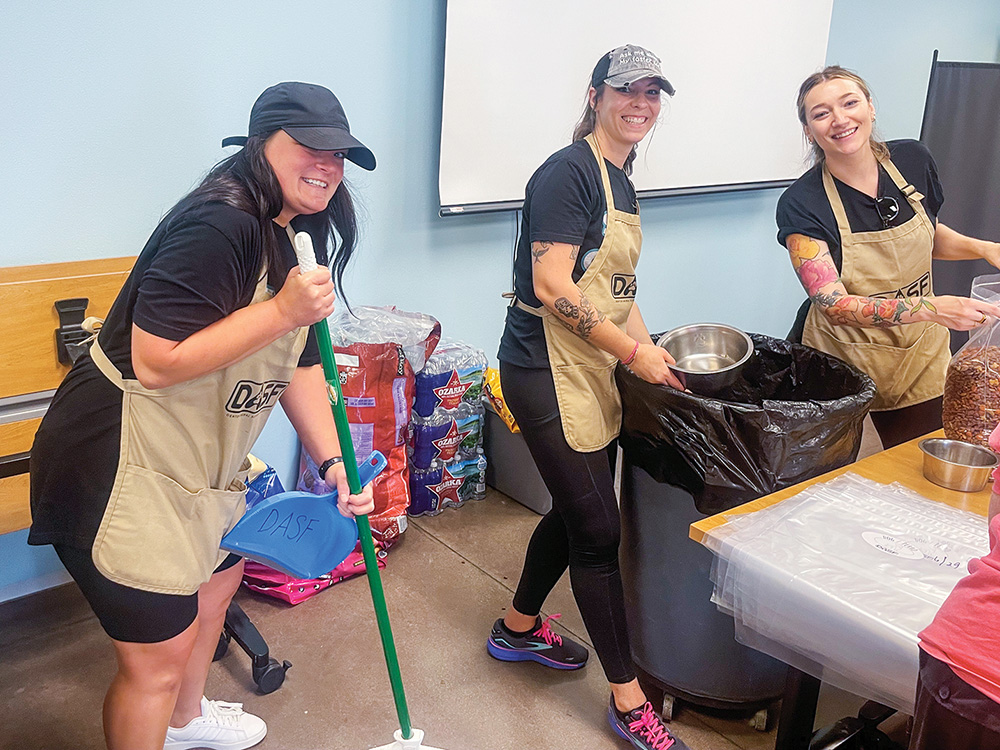 J: CoServ Community Event Specialist Ashtin Pizarro (left) dedicates time to volunteering with the North Texas nonprofit, The Happy Pet Project, which she co-founded.