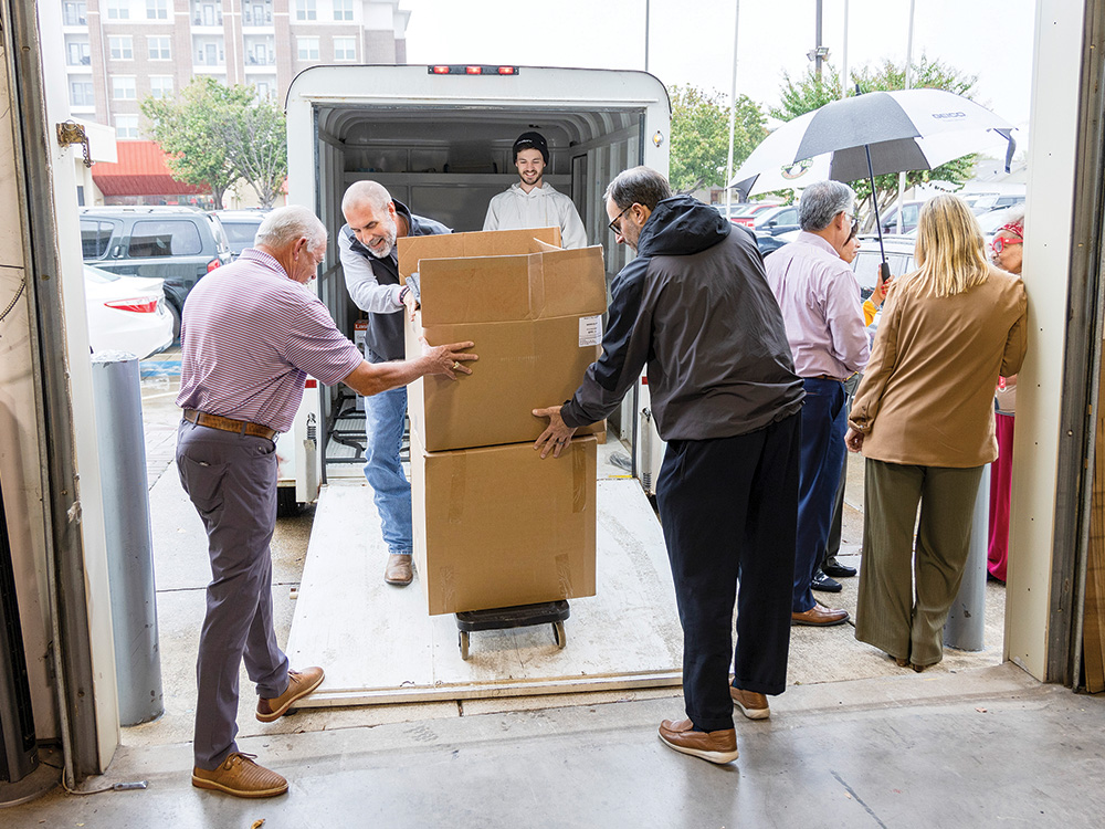 Vice Chairman and District 6 Board Director, Bill Ragsdale, helps unload blankets and heaters at Christian Community Action.