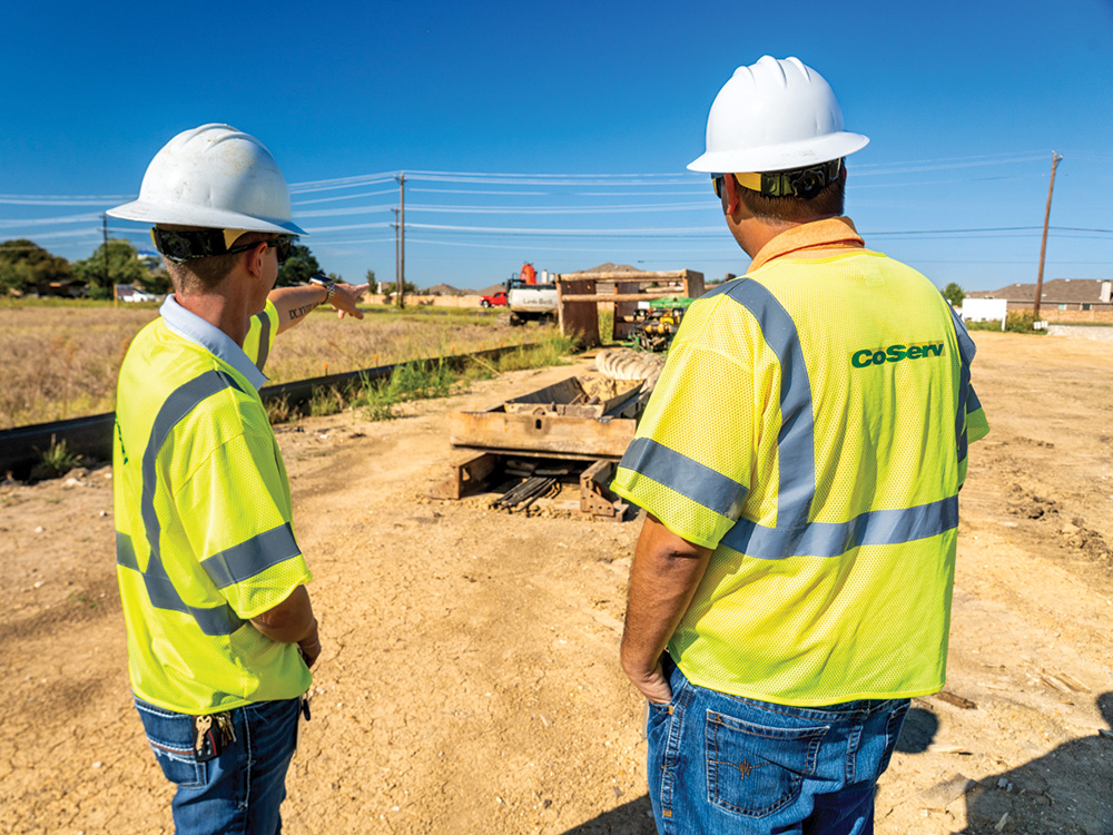 CoServ Gas Damage Prevention Supervisor Russell Moody and Gas Damage Prevention Specialist David Miller discuss the alignment of a bore project by a contractor.