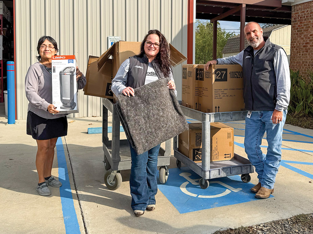 M: The CoServ Charitable Foundation donates portable heaters and blankets to Volunteers In Service to Others (VISTO) in Gainesville.