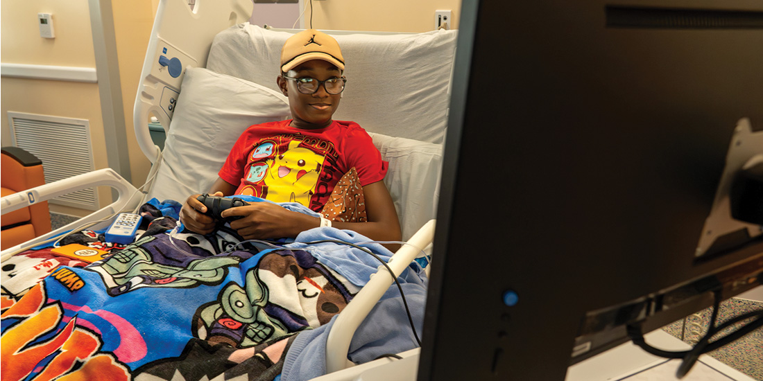Jackson Cole, 14, plays on a PlayStation Go Kart at Cook Children’s Medical Center in Prosper. The GO Kart was donated by CoServ Charitable Foundation through a grant to Gamers Outreach, giving hospitalized kids a fun way to play. Photos by BRIAN ELLEDGE